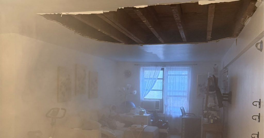 Residential apartment after ceiling collapse requiring emergency dust remediation and HEPA cleaning