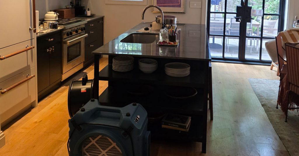HEPA air scrubbers and containment measures used during residential dust cleanup following electrical repairs
