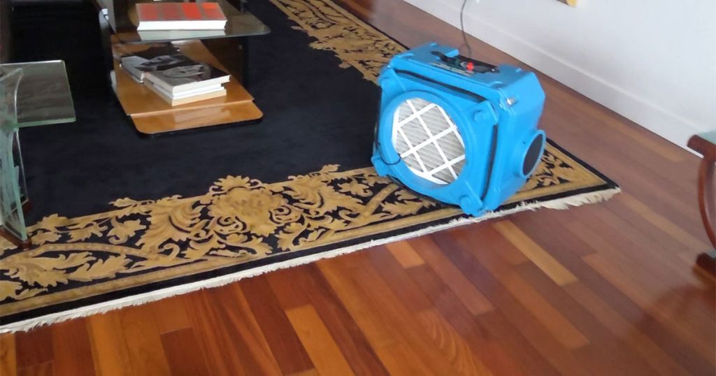 HEPA air scrubber operating during professional construction dust cleaning inside a luxury NYC apartment