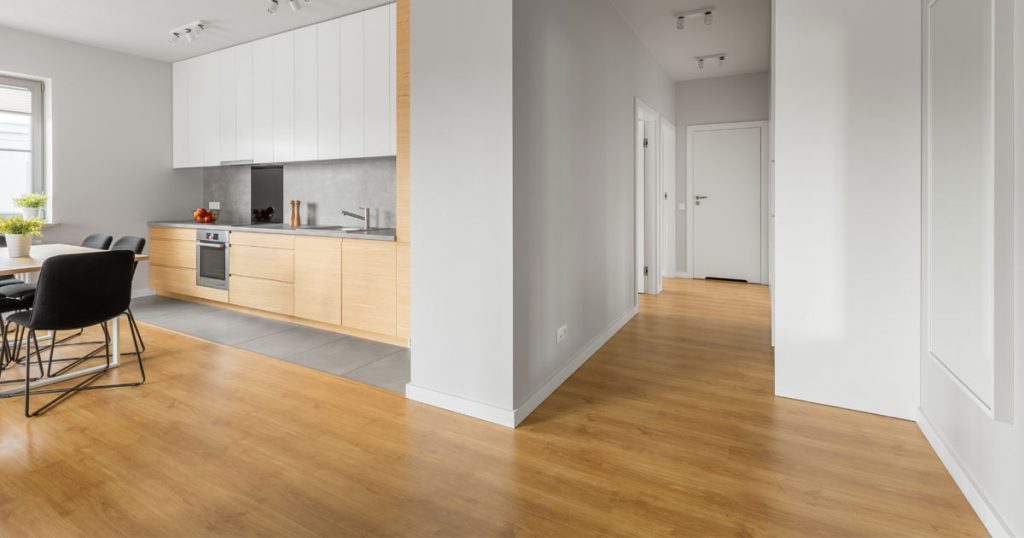 Bright, newly renovated open-concept home with clean hardwood floors and modern kitchen after professional post-renovation cleaning.